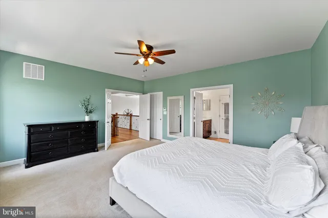 a bathroom with a sink vanity and a mirror
