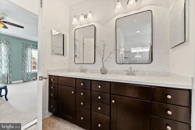 a spacious bedroom with a bed and a window