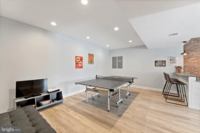 a view of a balcony with wooden floor and fence