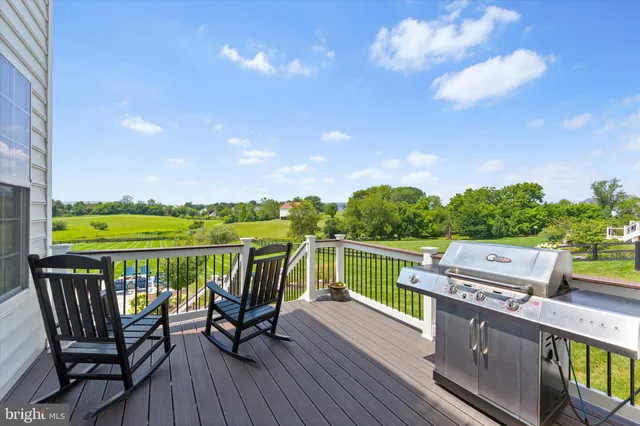 a sign that is sitting in the grass near a building