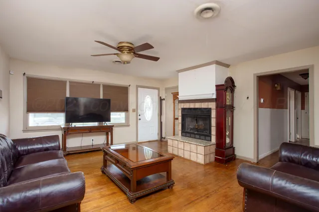 a living room with furniture and a fireplace