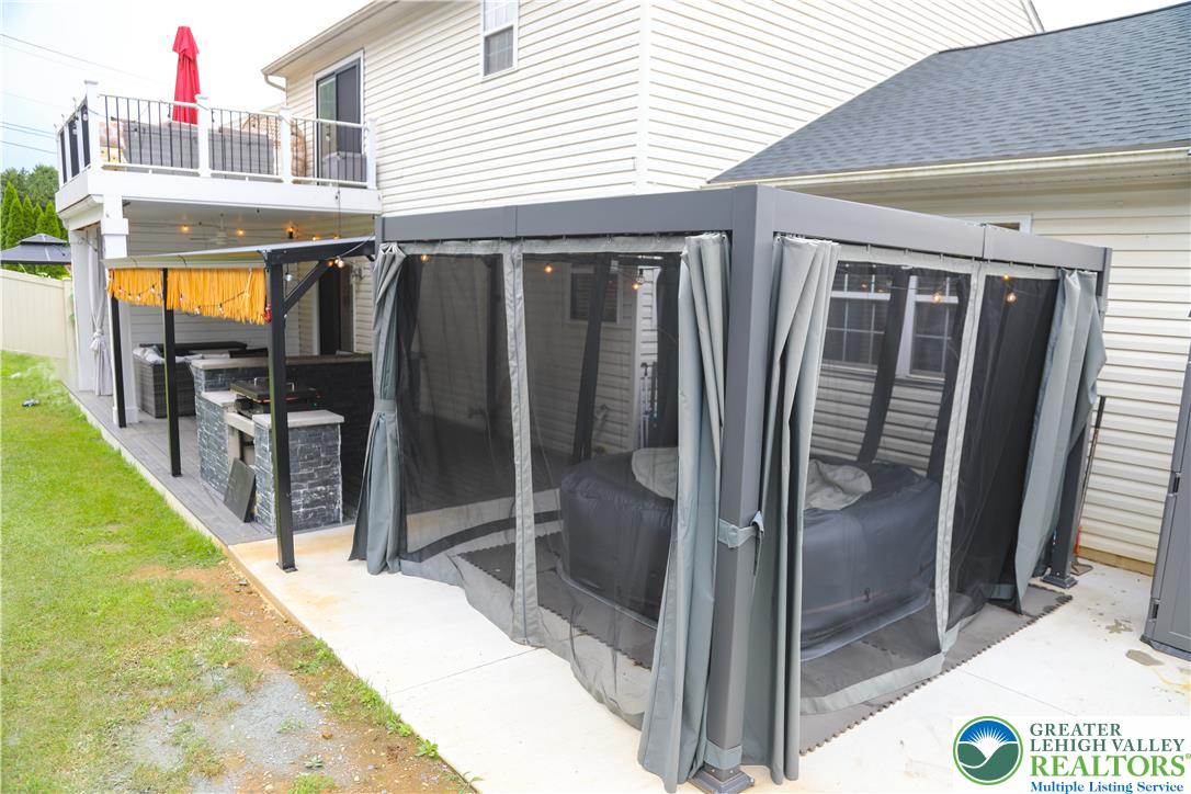 1412 Stanford Road Bethlehem, PA 18018 - Photo 55 of 58 An inviting backyard oasis offers a built-in outdoor kitchen with a spacious upper deck for relaxation and entertaining.