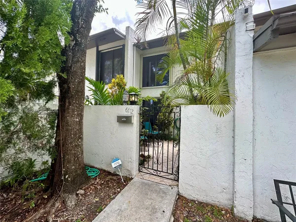 a house view with a garden space
