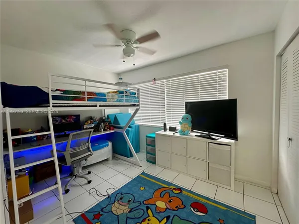 a room with furniture and flat screen tv