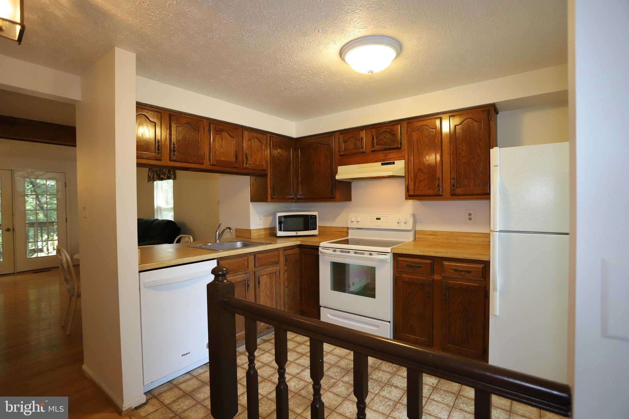 1915 Belmont Ridge Court Reston, VA 20191 - Photo 18 of 23 Enter and be greeted by the Cheery Kitchen
