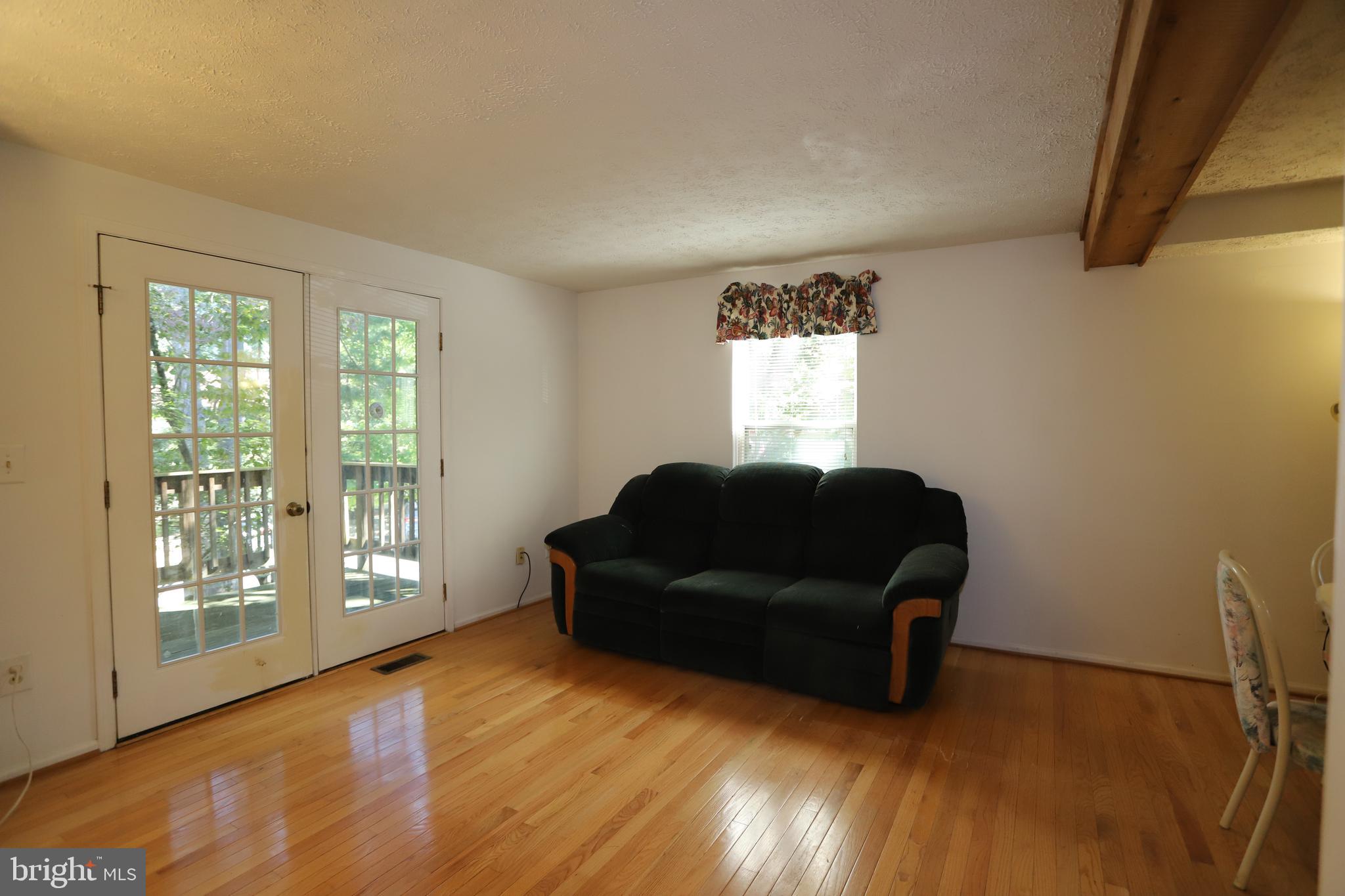 1915 Belmont Ridge Court Reston, VA 20191 - Photo 7 of 23 Living Room has Hardwoood Floors