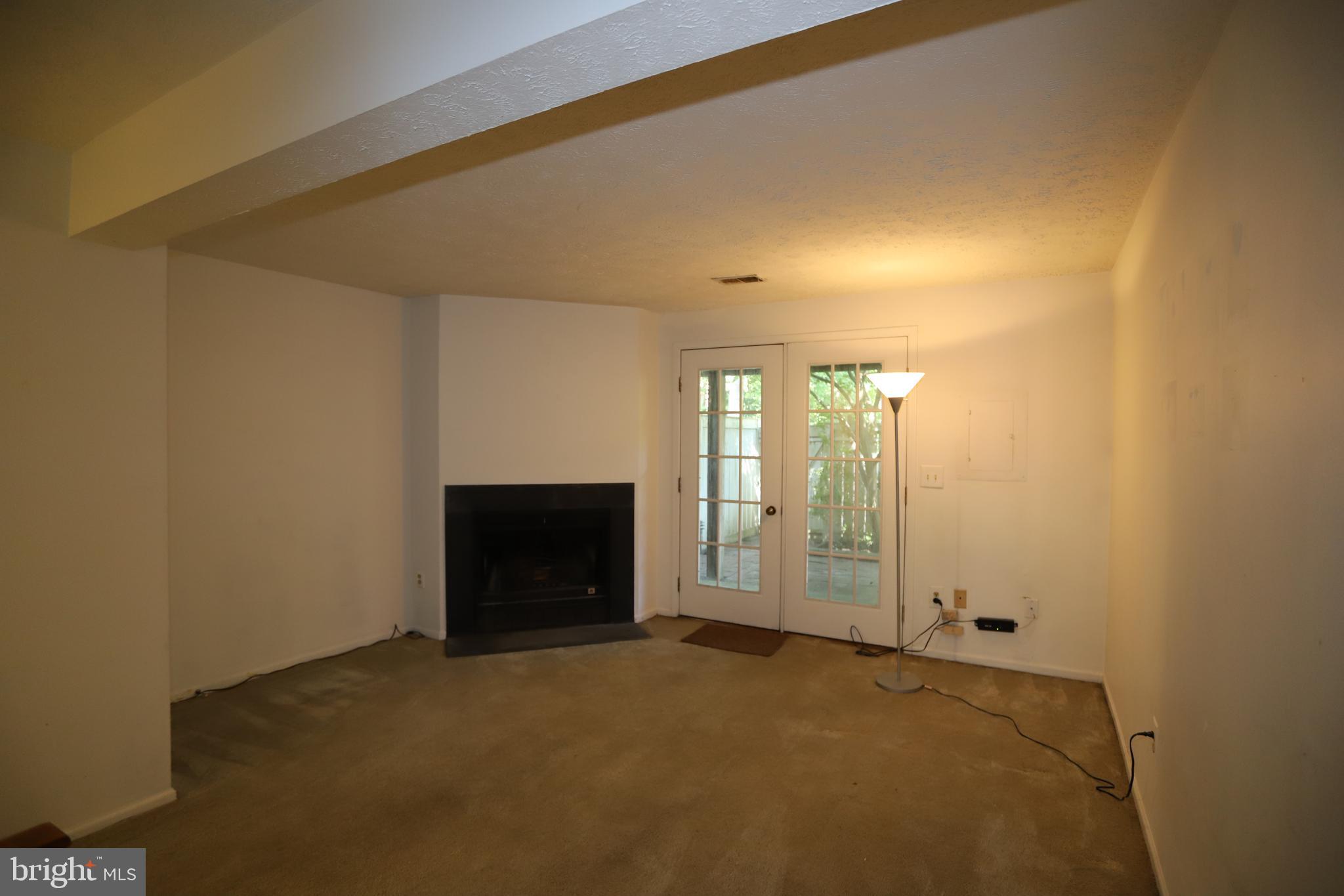 1915 Belmont Ridge Court Reston, VA 20191 - Photo 10 of 23 Lower Level has fireplace, exit to yard, closet