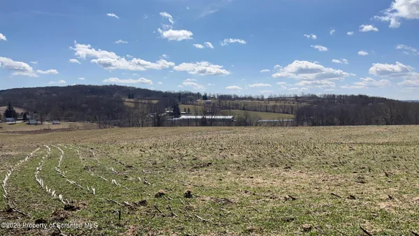 a view of an ocean and mountain