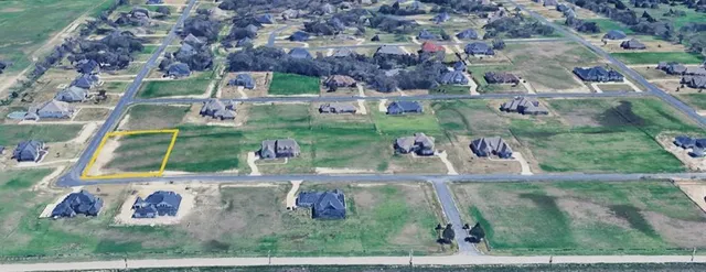 an aerial view of a house with a yard basket ball court and outdoor seating