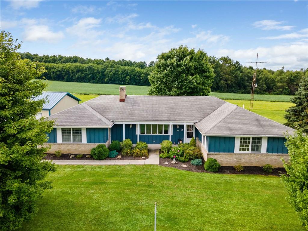 360 Golf Road Mercer, PA 16137 - Photo 1 of 25 a aerial view of a house with a yard table and chairs