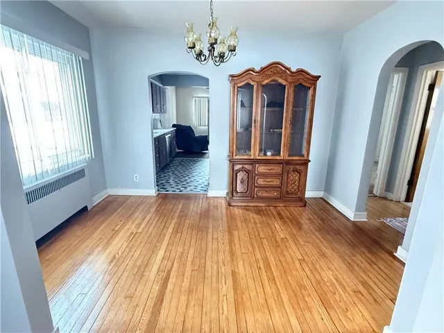 a view of a room with wooden floor and staircase