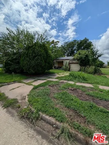 a view of backyard with green space