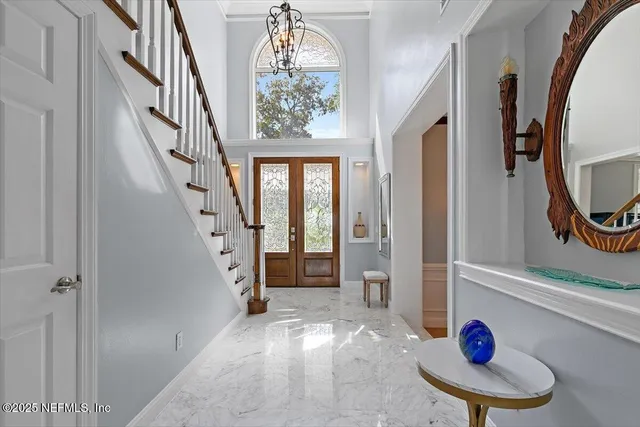 a kitchen with stainless steel appliances kitchen island granite countertop a refrigerator and a sink