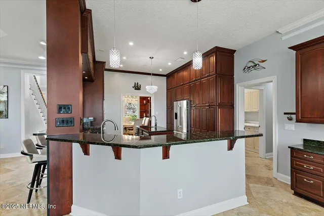 a view of staircase with wooden floor and fan