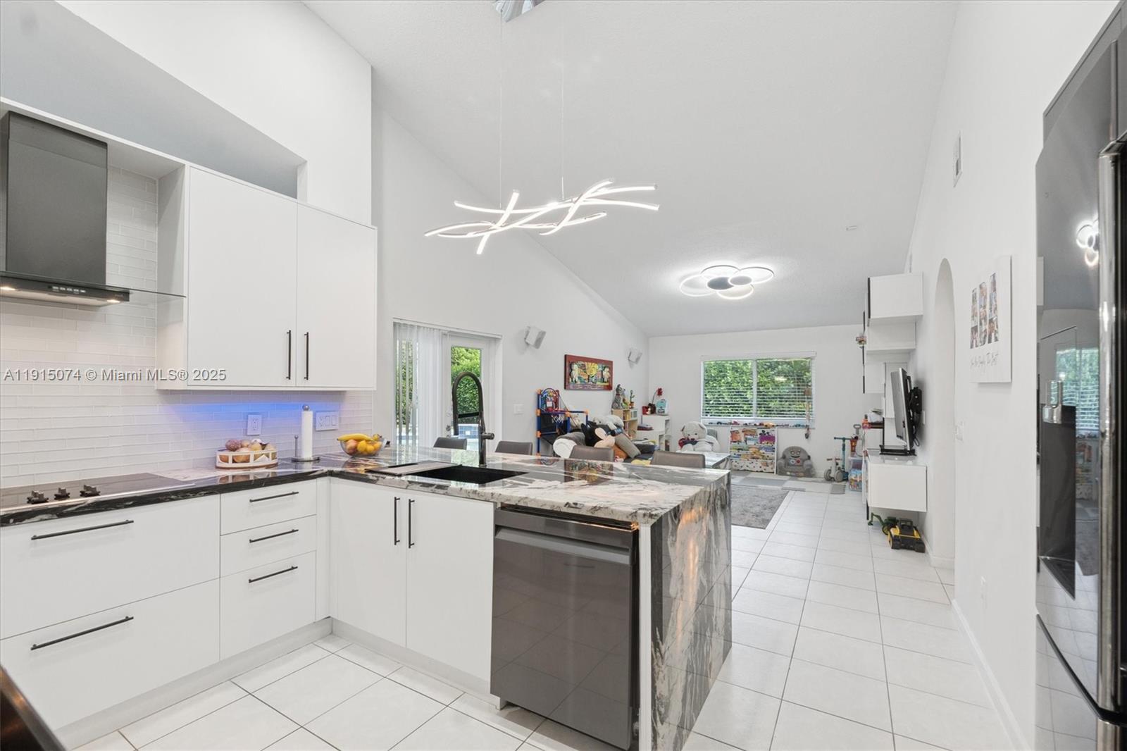 1510 Southwest 96th Terrace Davie, FL 33324 - Photo 13 of 28 a kitchen with a sink stove and cabinets