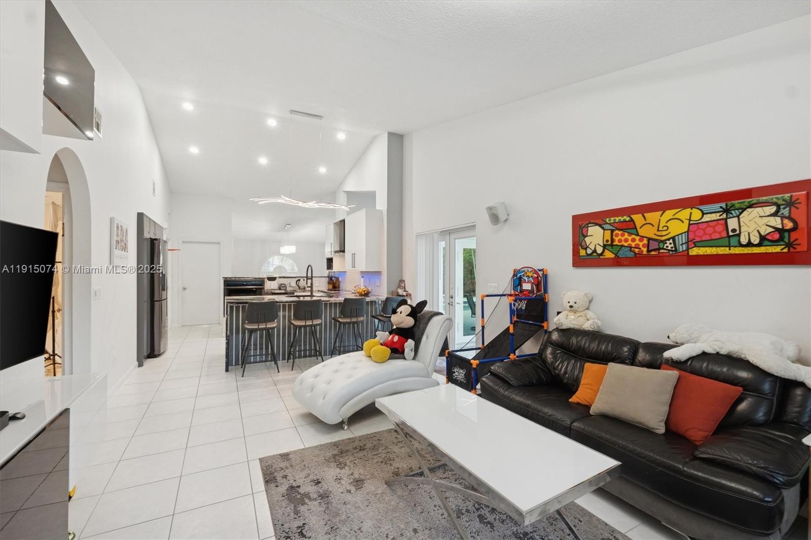 1510 Southwest 96th Terrace Davie, FL 33324 - Photo 14 of 28 a living room with lots of furniture and kitchen view