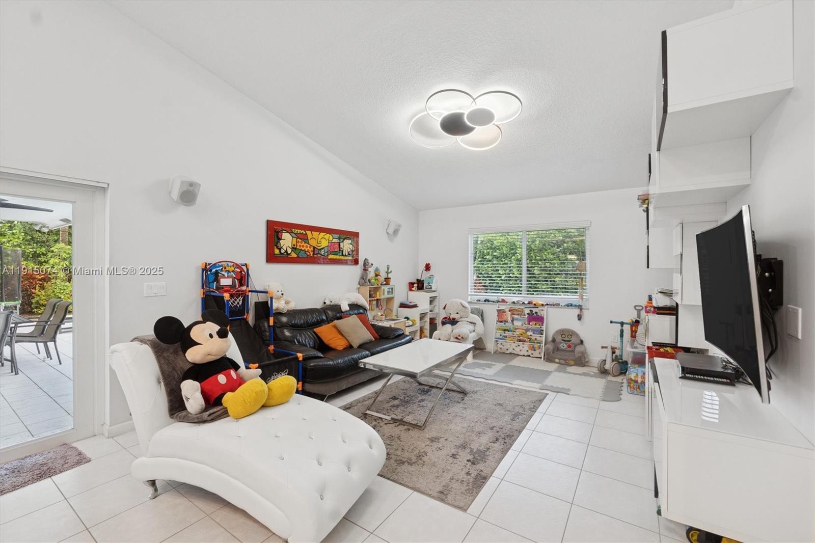 1510 Southwest 96th Terrace Davie, FL 33324 - Photo 15 of 28 a living room with furniture a window and a flat screen tv