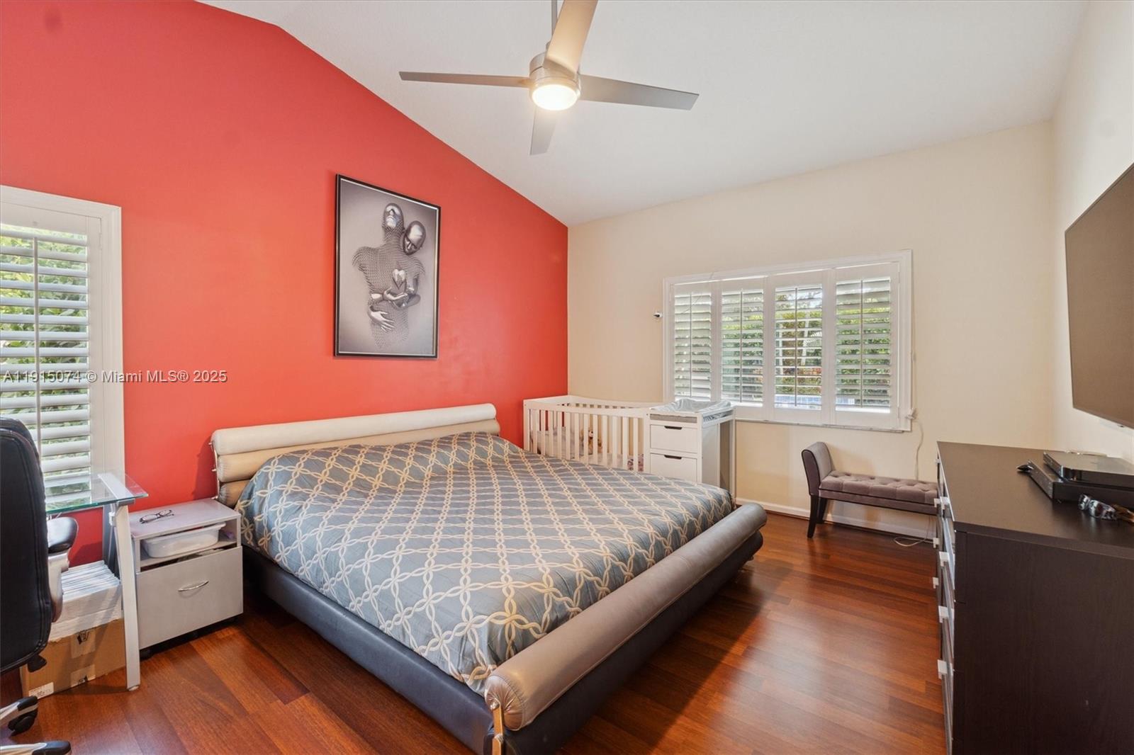 1510 Southwest 96th Terrace Davie, FL 33324 - Photo 17 of 28 a bedroom with a bed and wooden floor