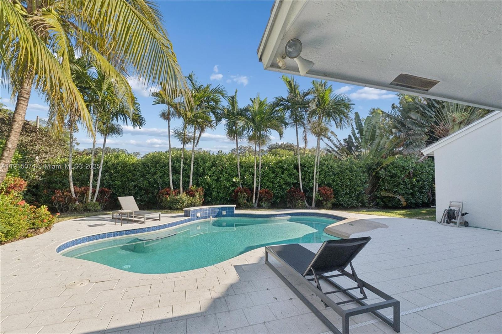1510 Southwest 96th Terrace Davie, FL 33324 - Photo 2 of 28 a swimming pool with outdoor seating and yard