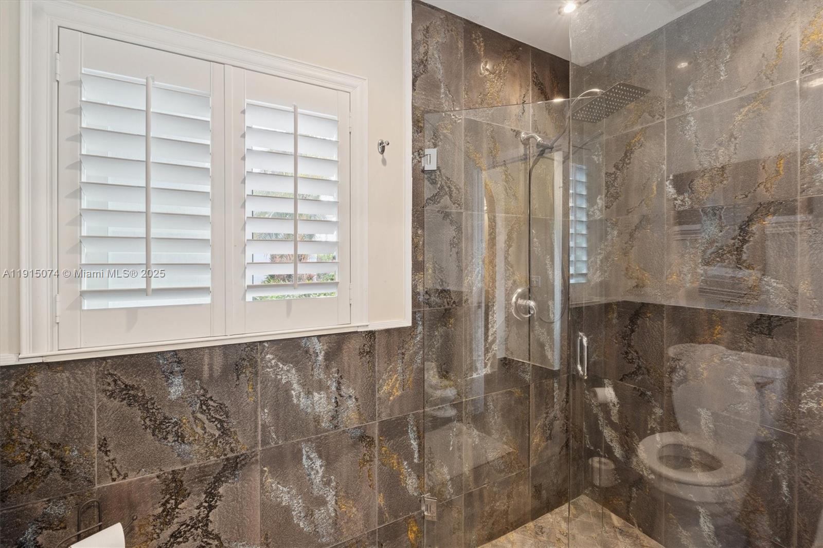 1510 Southwest 96th Terrace Davie, FL 33324 - Photo 21 of 28 a bathroom with a shower and toilet