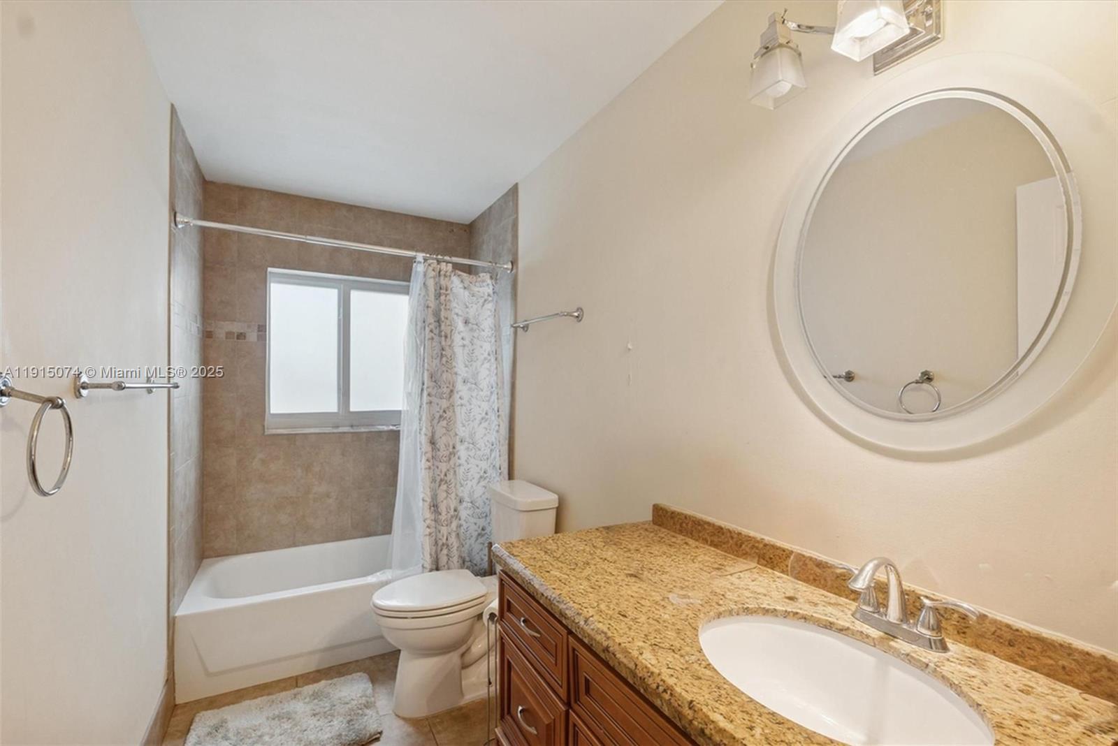 1510 Southwest 96th Terrace Davie, FL 33324 - Photo 25 of 28 a bathroom with a granite countertop sink toilet and shower