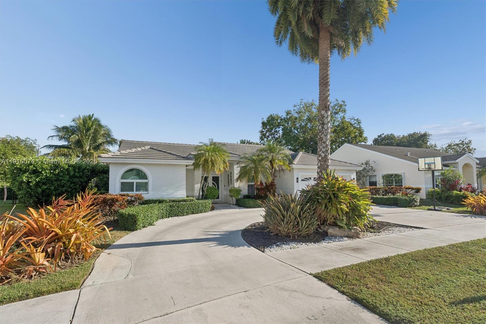 1510 Southwest 96th Terrace Davie, FL 33324 - Photo 4 of 28 a front view of a house with garden