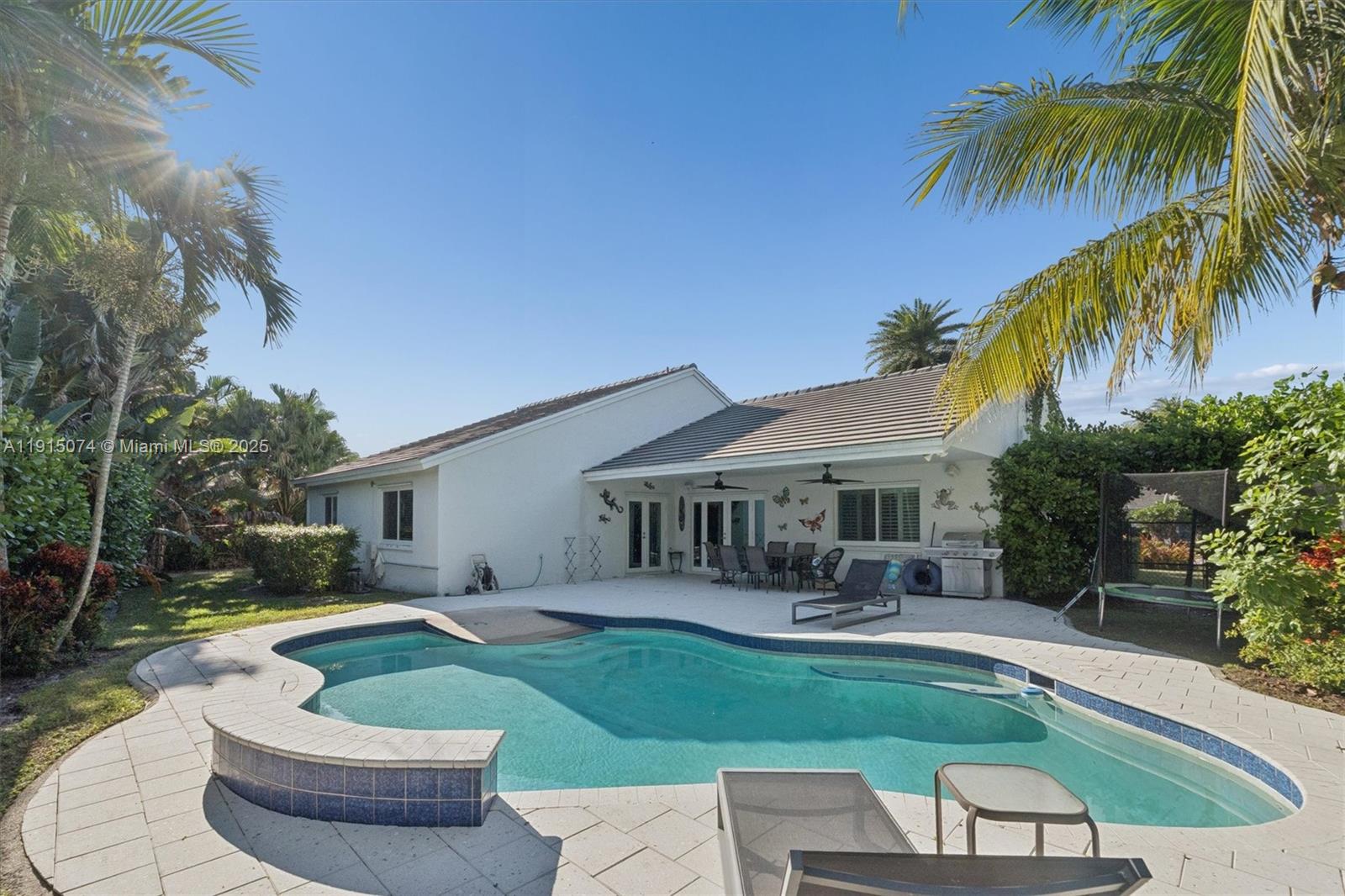 1510 Southwest 96th Terrace Davie, FL 33324 - Photo 6 of 28 a house view with swimming pool and garden