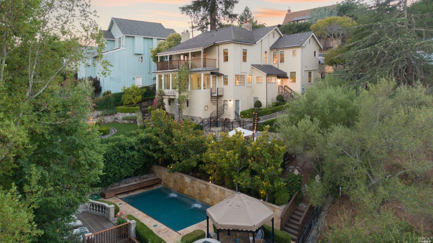 a view of a patio with table and chairs and potted plants