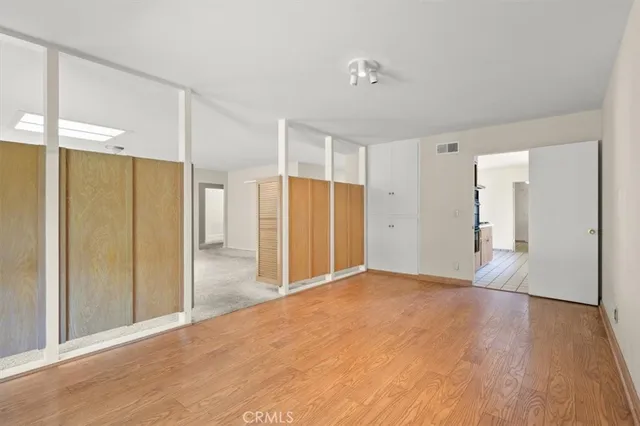 a view of a livingroom with wooden floor