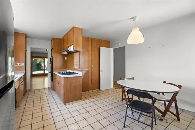 a kitchen with a sink cabinets and window
