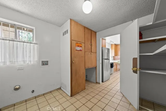 a view of a porch with furniture and garden