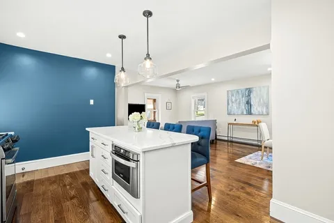 a kitchen with a stove a sink and a refrigerator