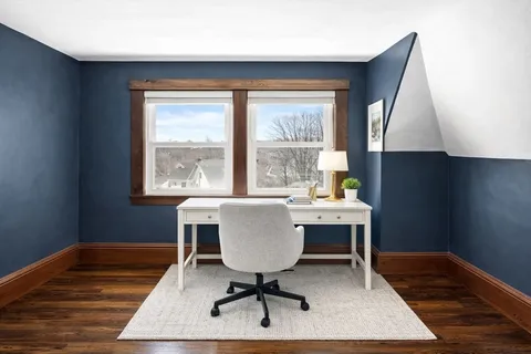 a workspace with furniture and window