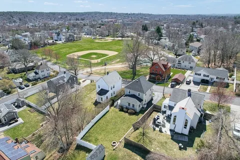 an aerial view of residential houses with outdoor space