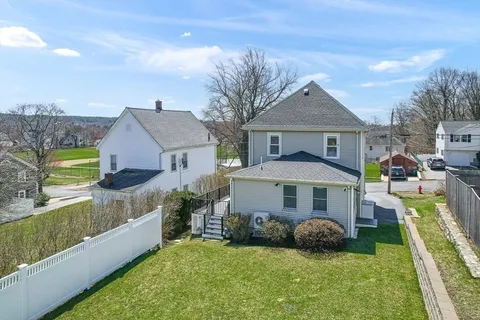 an aerial view of a house with a ocean view