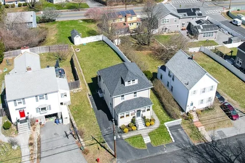 an aerial view of residential houses with outdoor space
