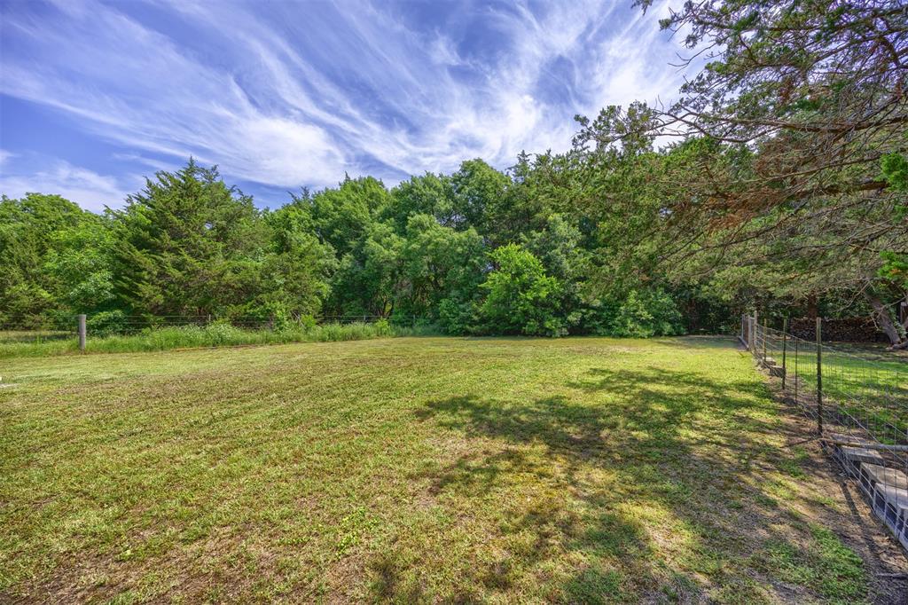 881 Wild Road Van Alstyne, TX 75495 - Photo 33 of 40 a view of outdoor space with deck and yard