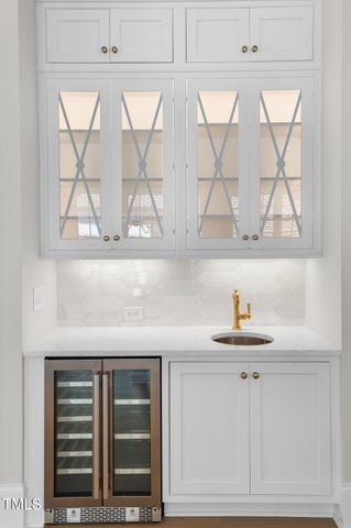 a bathroom with a sink a vanity and a window