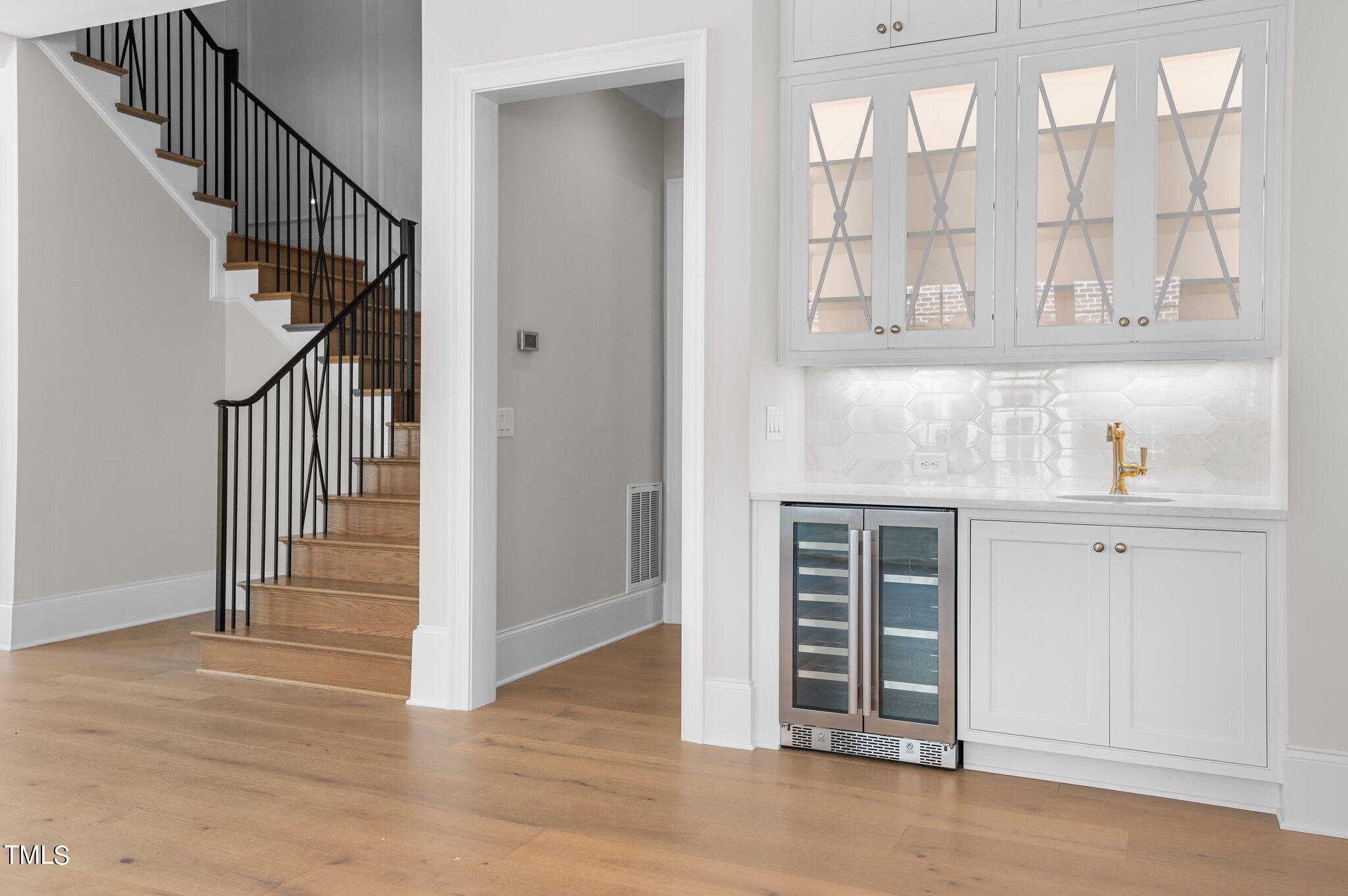 2639 Marchmont Street Raleigh, NC 27608 - Photo 13 of 41 a view of entryway and hall with wooden floor