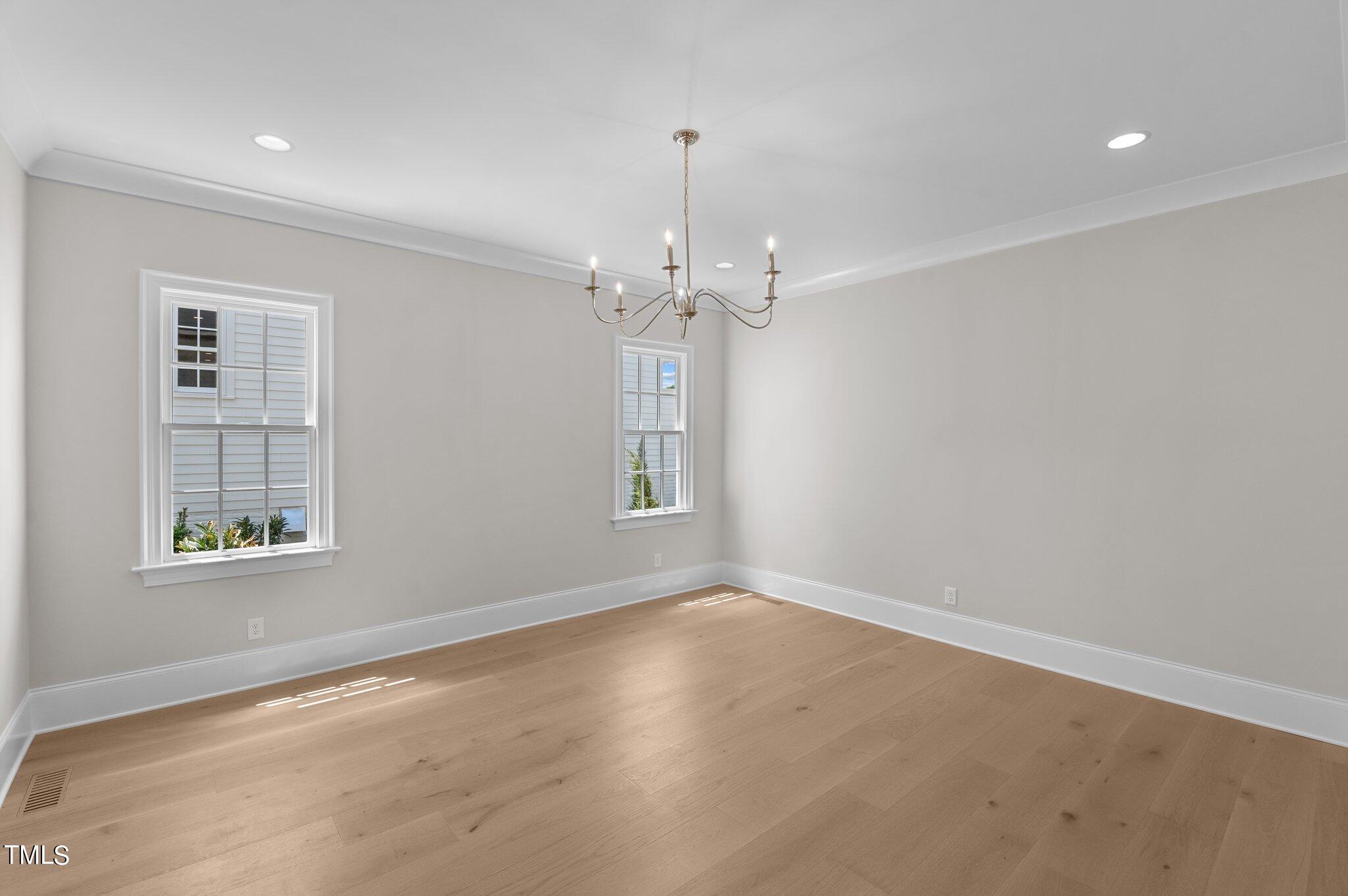 2639 Marchmont Street Raleigh, NC 27608 - Photo 16 of 41 an empty room with windows and entrance