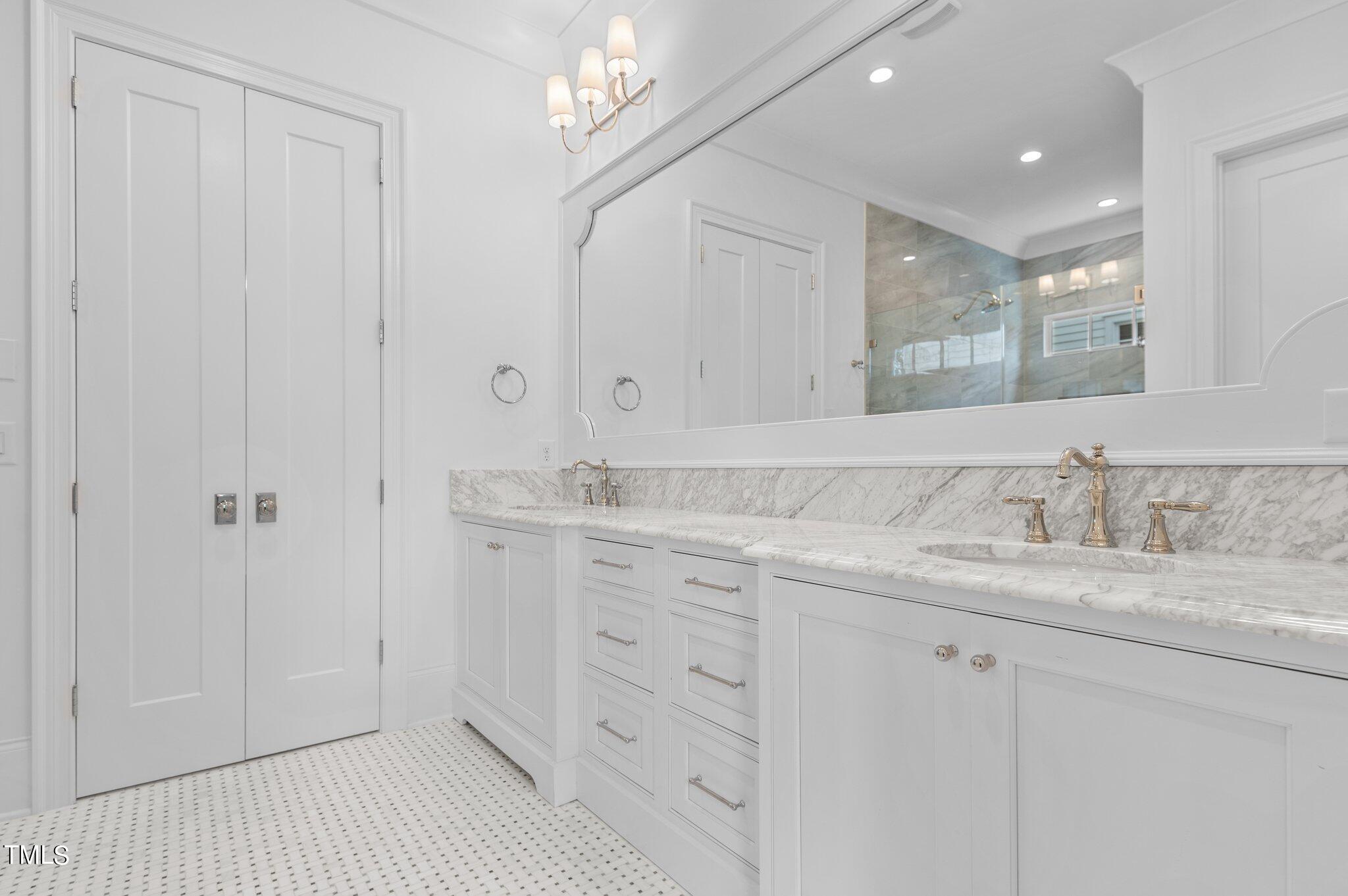 2639 Marchmont Street Raleigh, NC 27608 - Photo 19 of 41 a bathroom with a double vanity sink and a mirror