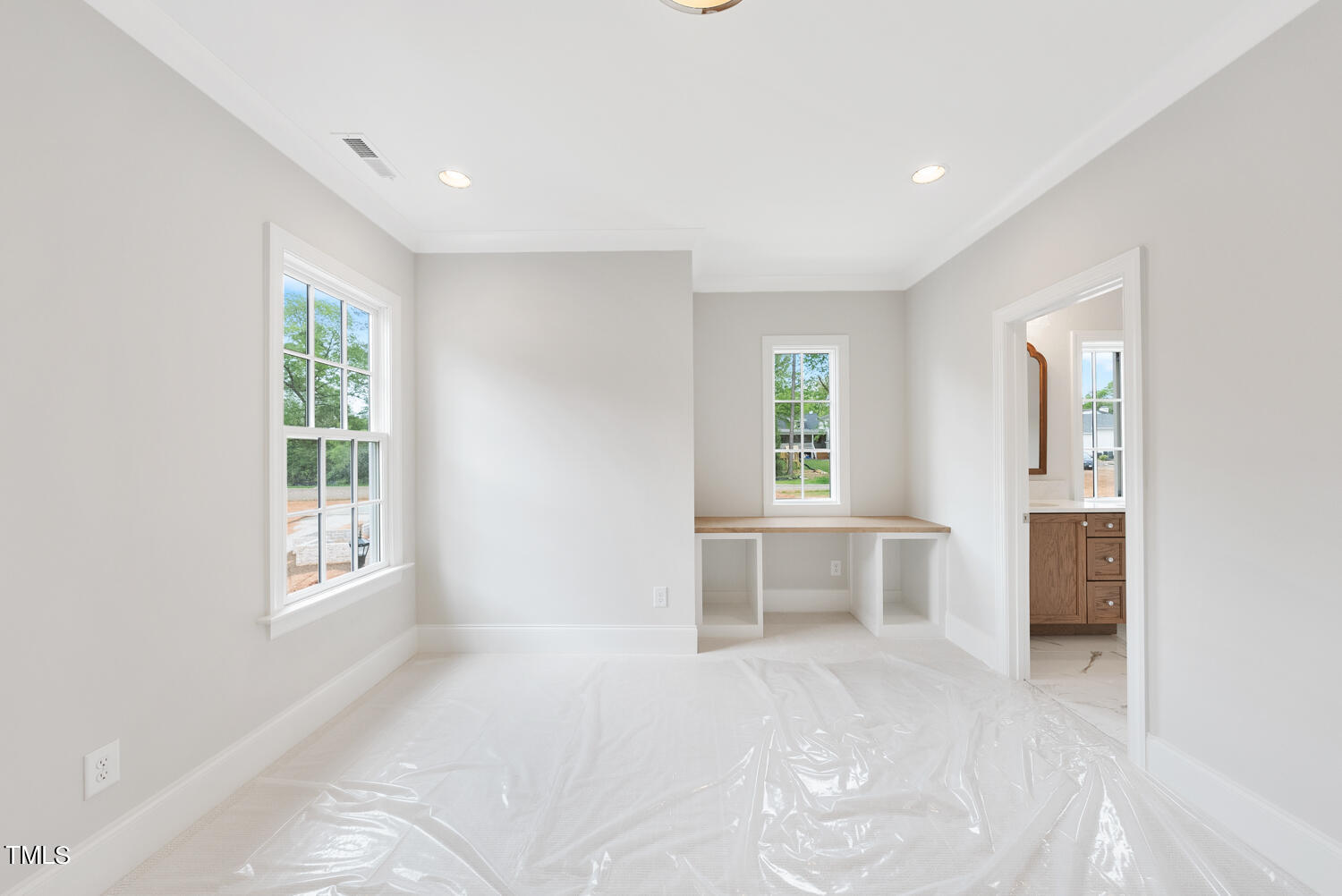 2639 Marchmont Street Raleigh, NC 27608 - Photo 28 of 41 a view of an empty room with a window and a kitchen
