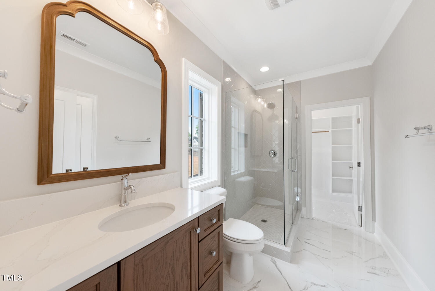 2639 Marchmont Street Raleigh, NC 27608 - Photo 29 of 41 a bathroom with a toilet a sink a mirror and a shower