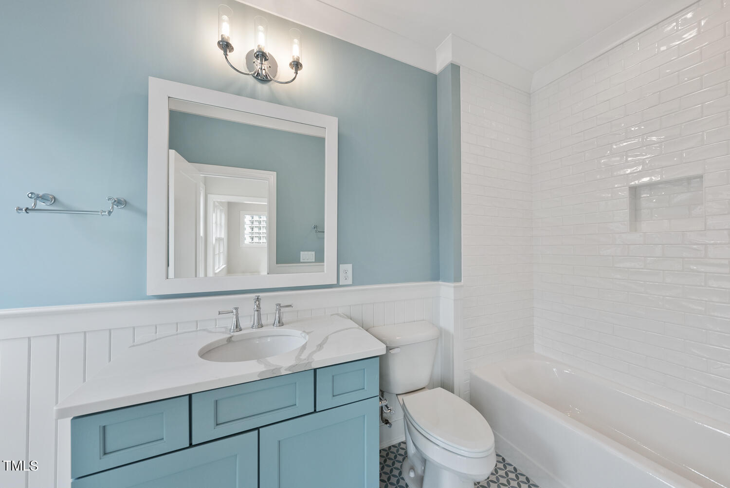 2639 Marchmont Street Raleigh, NC 27608 - Photo 33 of 41 a bathroom with a sink toilet vanity and tub