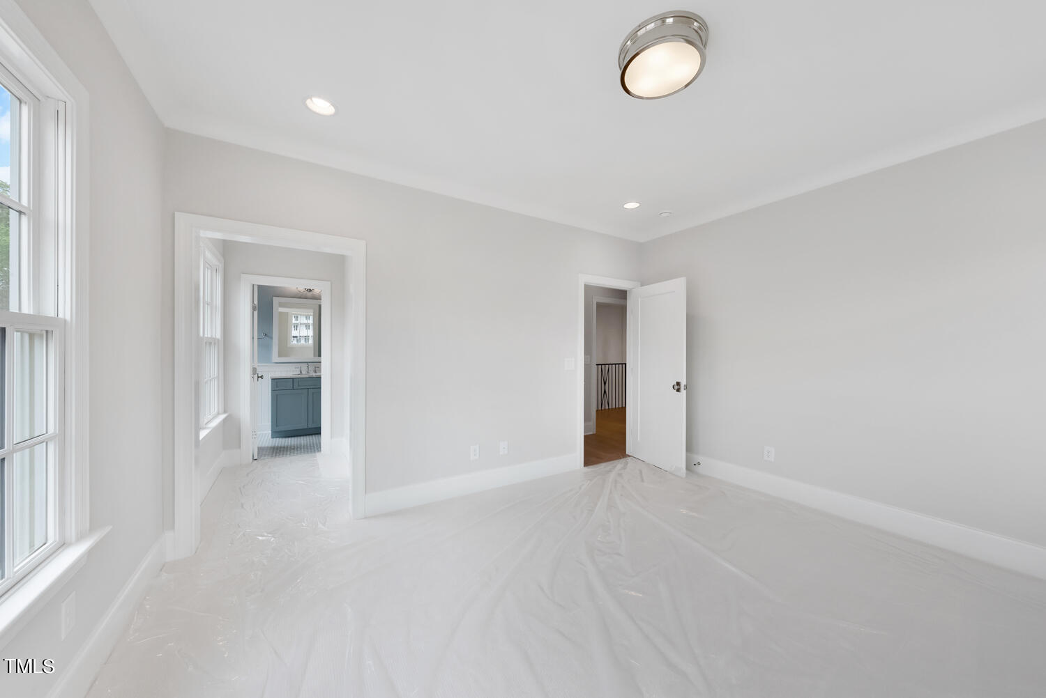 2639 Marchmont Street Raleigh, NC 27608 - Photo 34 of 41 an empty room with wooden floor and windows