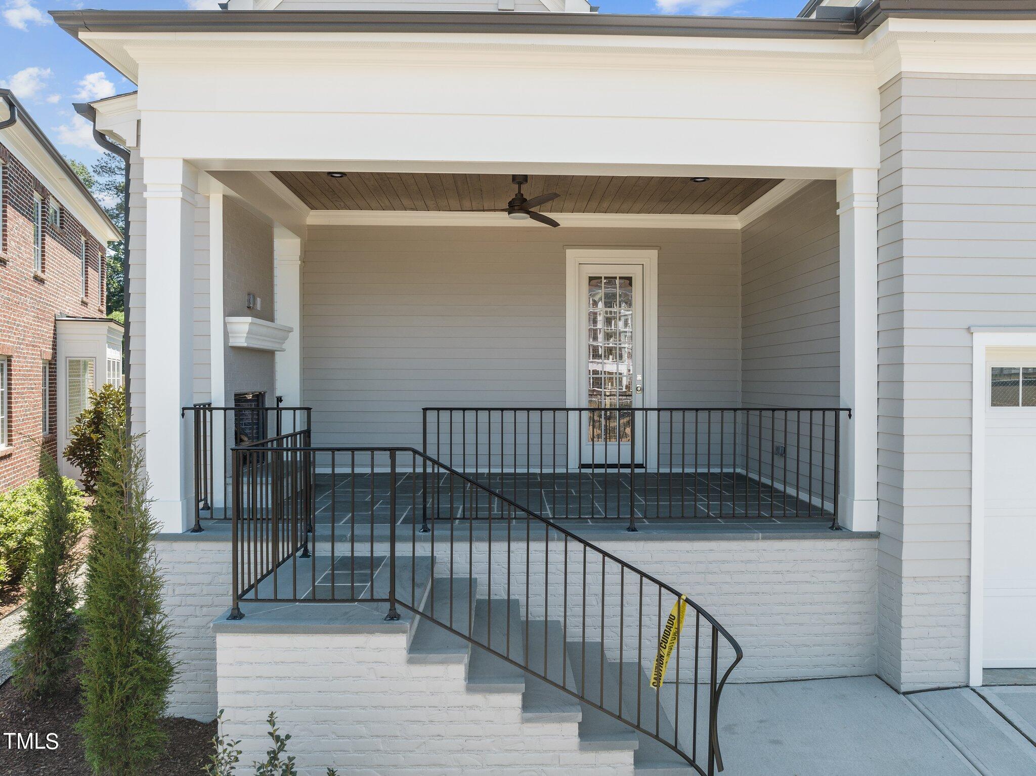 2639 Marchmont Street Raleigh, NC 27608 - Photo 37 of 41 a view of entryway and hall with wooden floor and fence