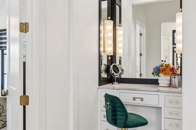 a spacious bedroom with a bed a couch and dresser