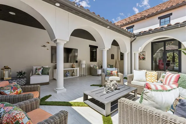 a outdoor living space with furniture and a fireplace