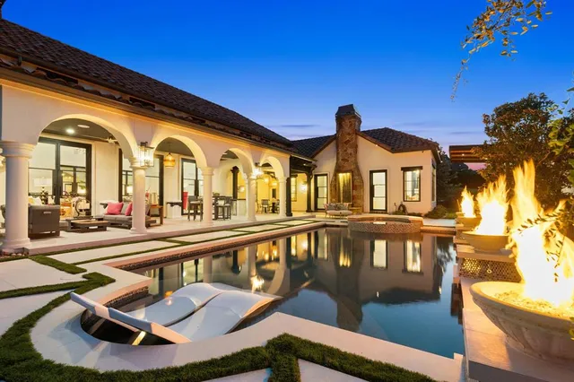 a front view of a house with swimming pool