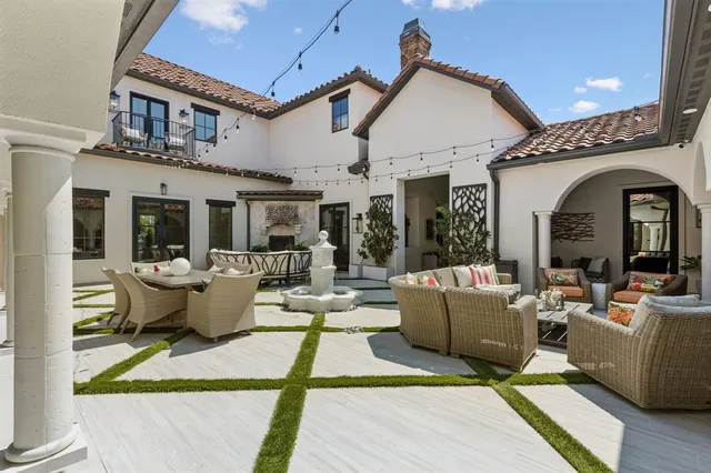 a view of balcony with wooden floor and outdoor seating